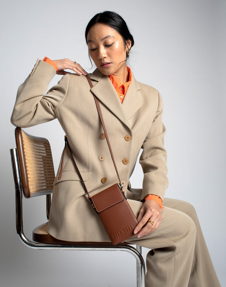 hyer goods recycled leather phone sling bag saddle brown tan#color_saddle-brown