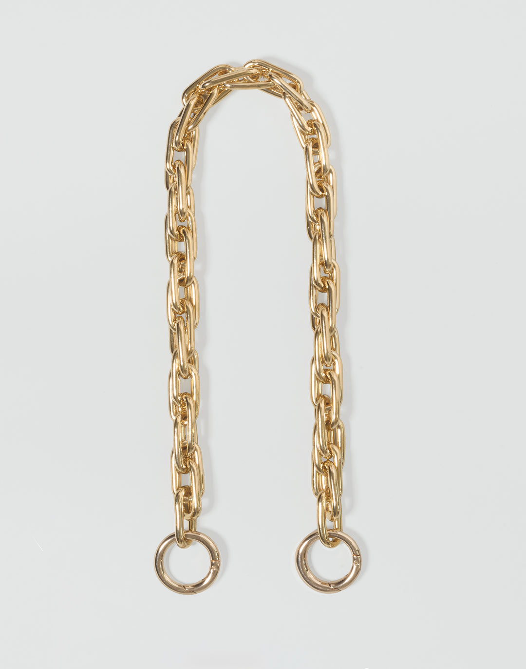 HYER GOODS gold-toned metal chain link accessory with two circular ring ends #color_gold
