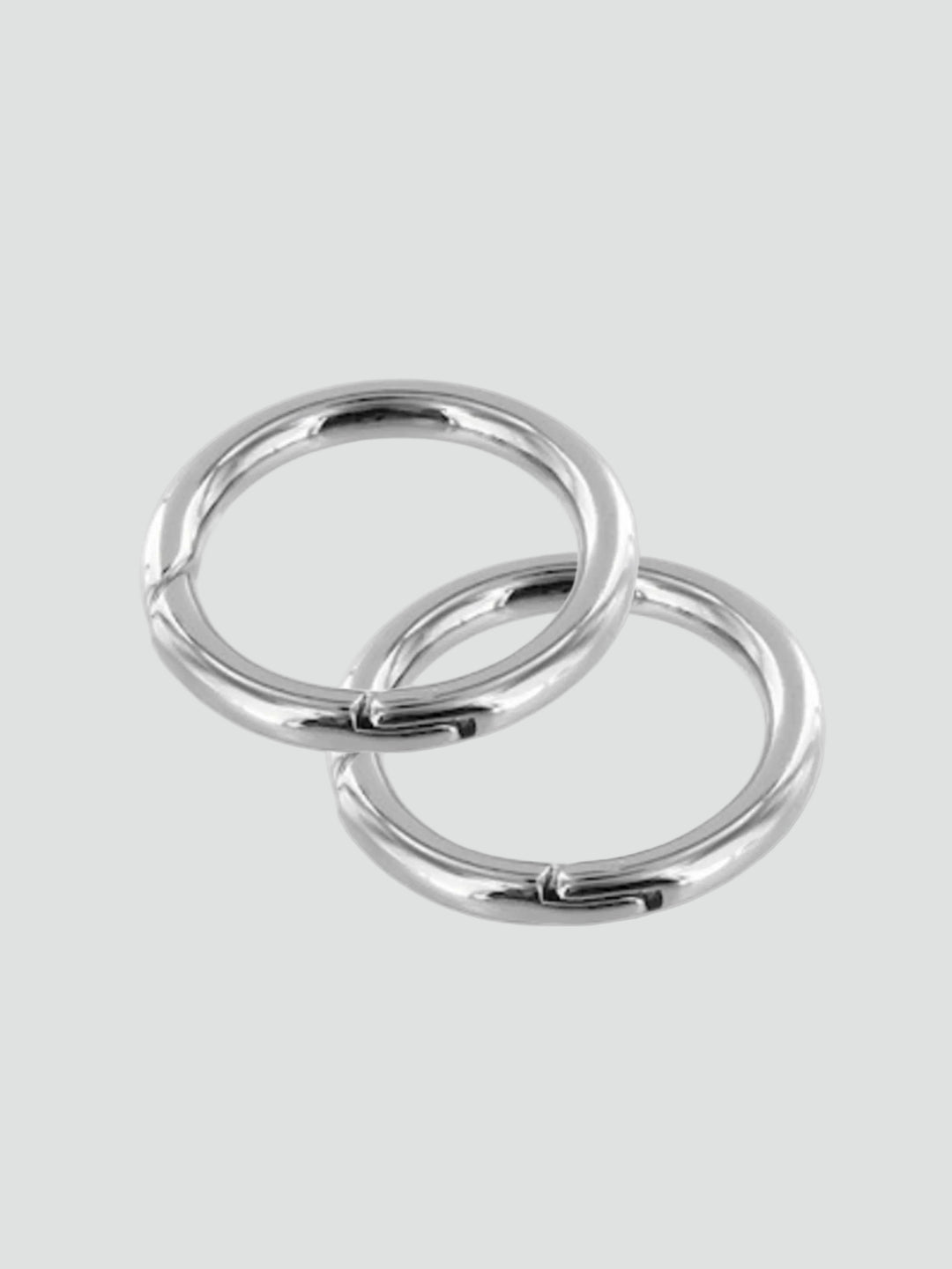 Two gold rings on a gray background #color_silver