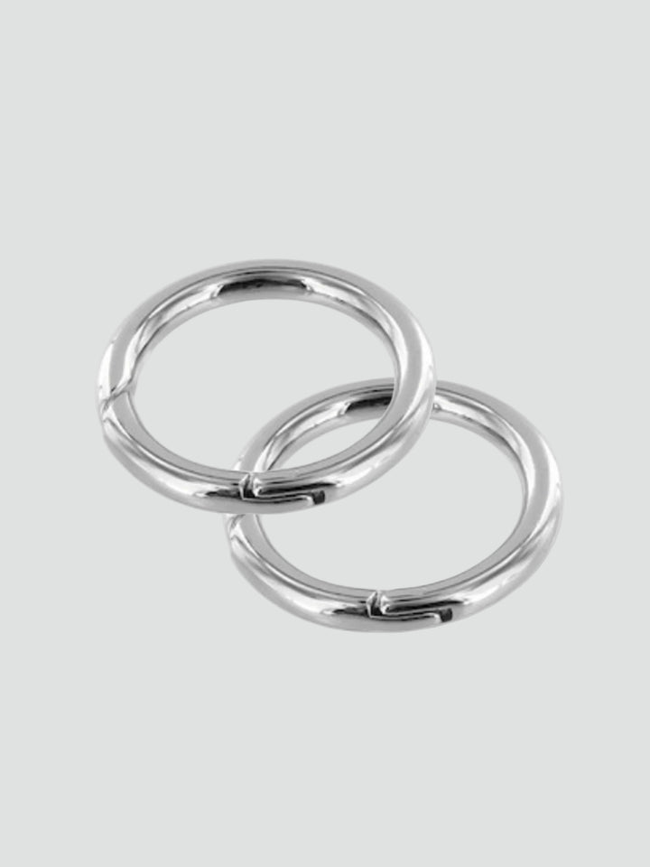 Two gold rings on a gray background #color_silver