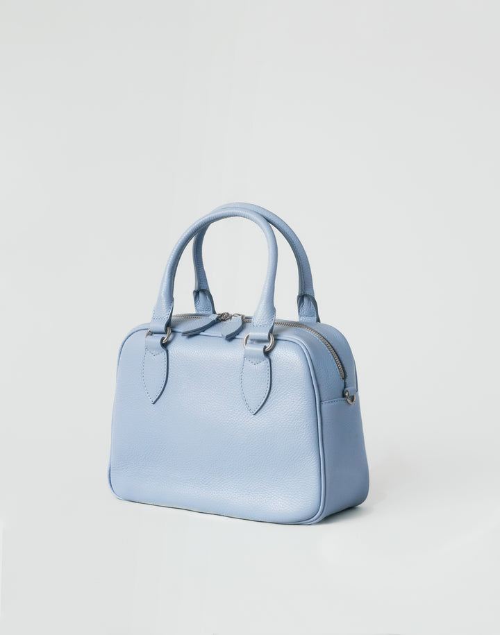 hyer goods la corsa pale blue leather bowling bag 3/4 view pale blue with silver hardware #color_pale-blue