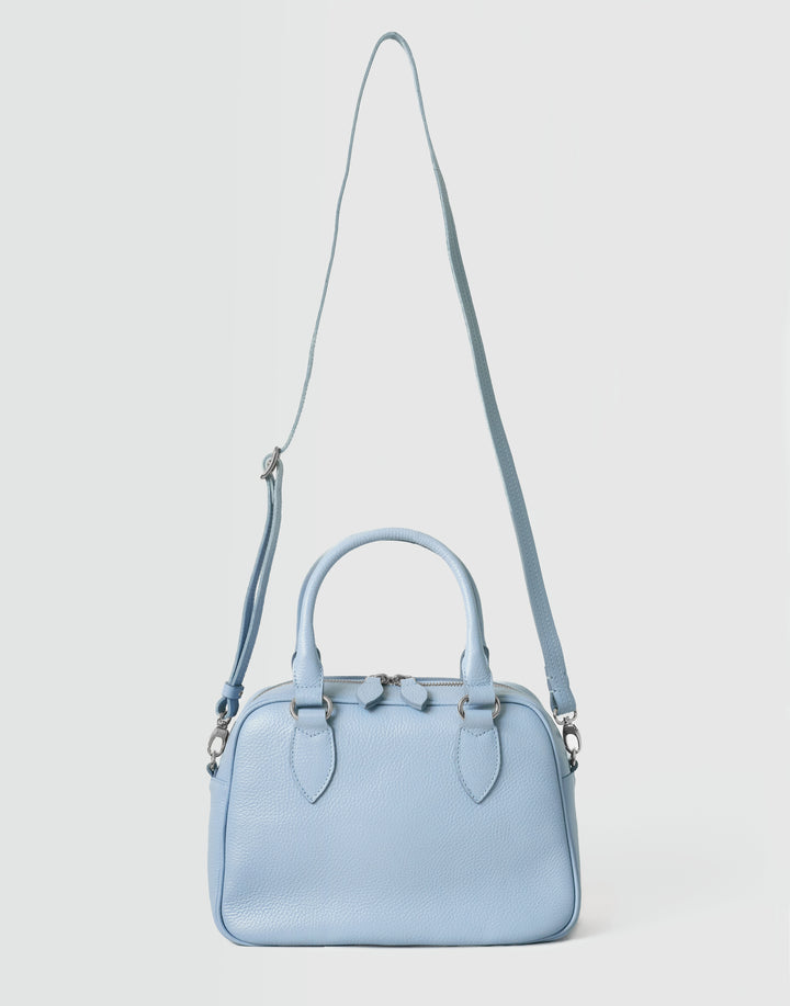 hyer goods la corsa pale blue leather bowling bag front view with crossbody strap pale blue with silver hardware #color_pale-blue