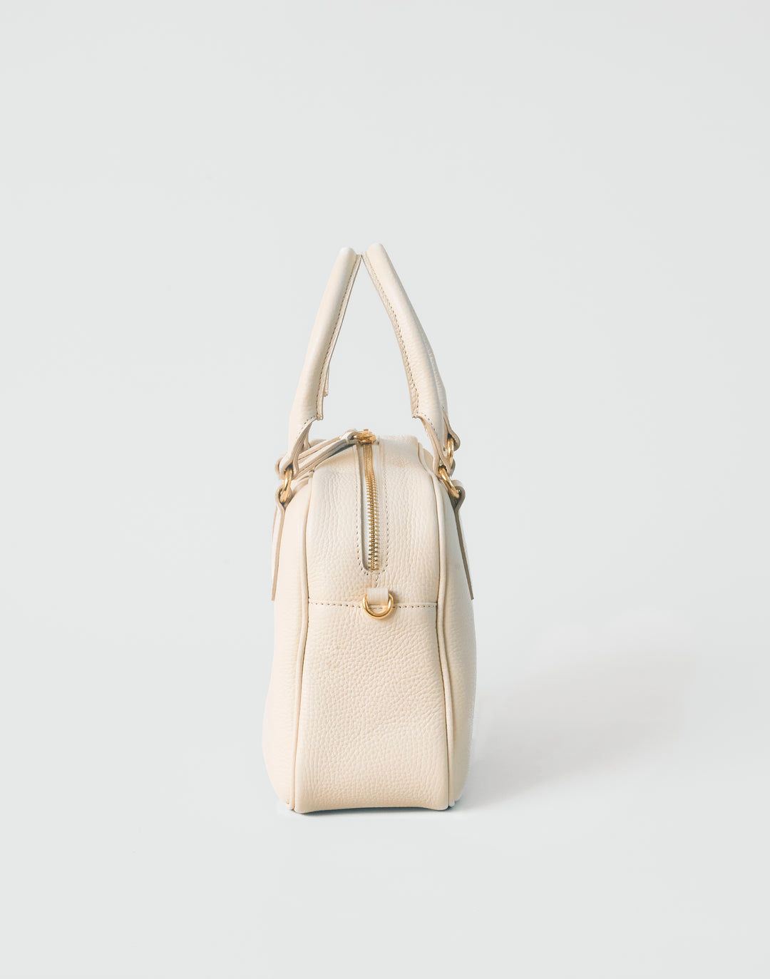 hyer goods la corsa off-white leather bowling bag side view bone with gold hardware #color_bone