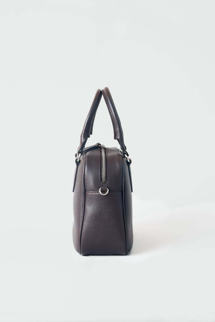 hyer goods la corsa dark brown leather bowling bag side view dark chocolate with silver hardware #color_dark-chocolate
