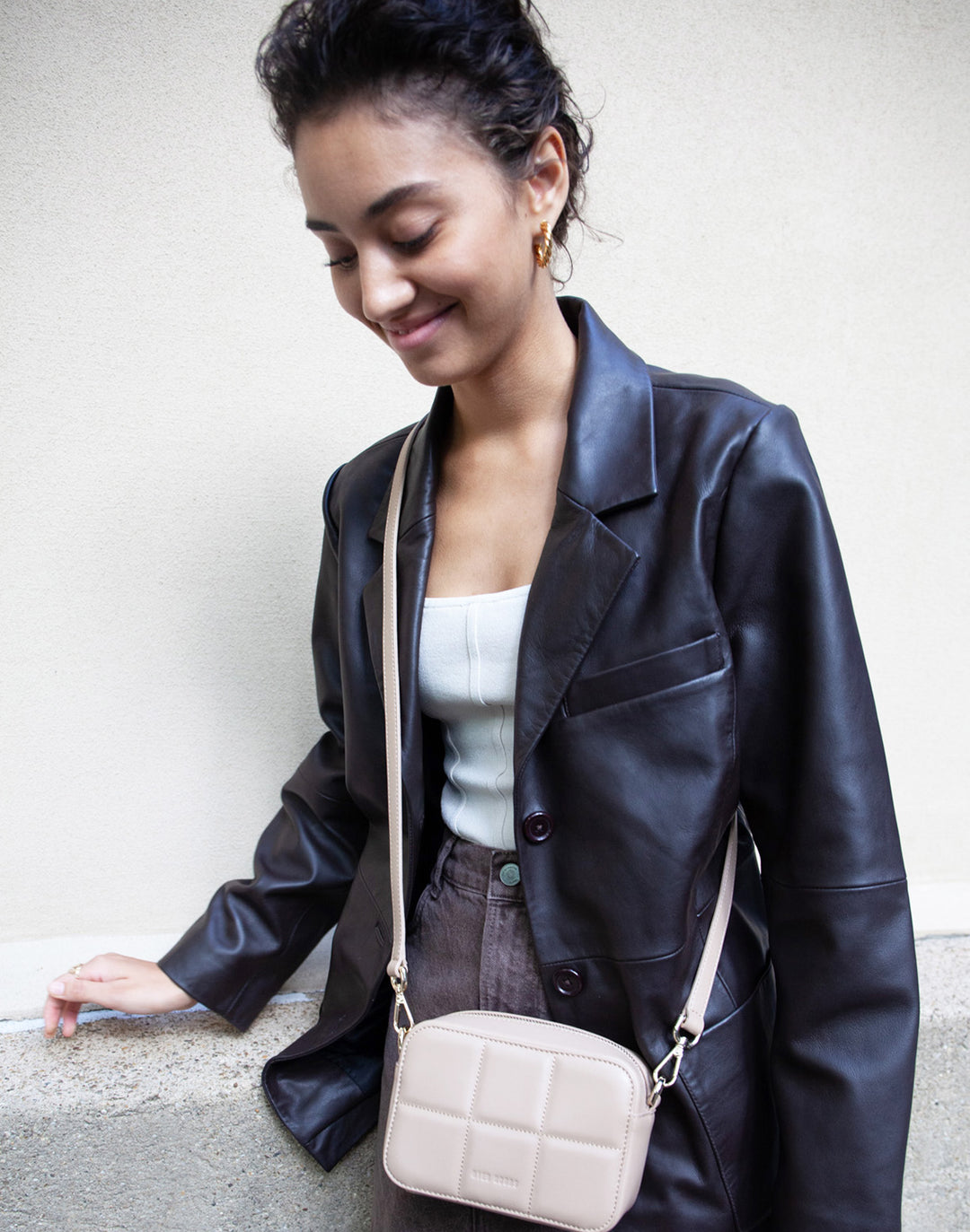 Sustainable leather blazer with relaxed fit in black #color_chocolate