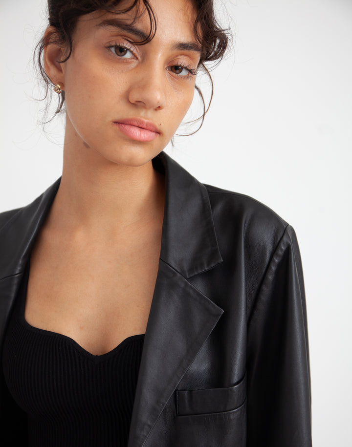 Close up of woman wearing Deadstock Leather Blazer #color_black