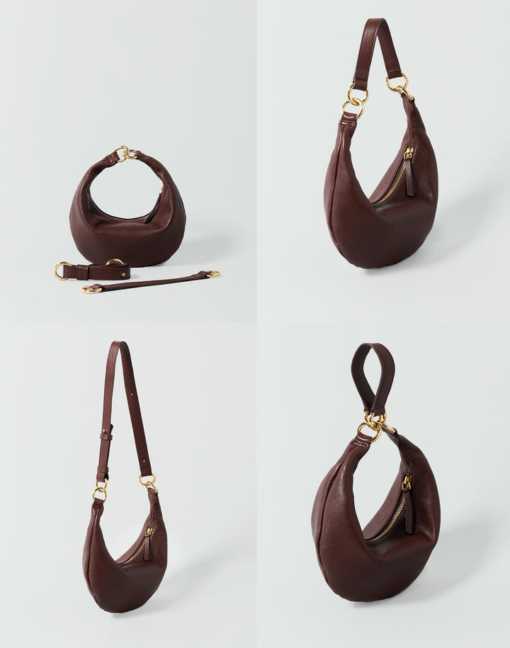 4 bags against a grey background, showing the same reddish brown crescent bag as a handheld bag, shoulder bag, crossbody bag and wristlet. #color_bordeaux-vintage