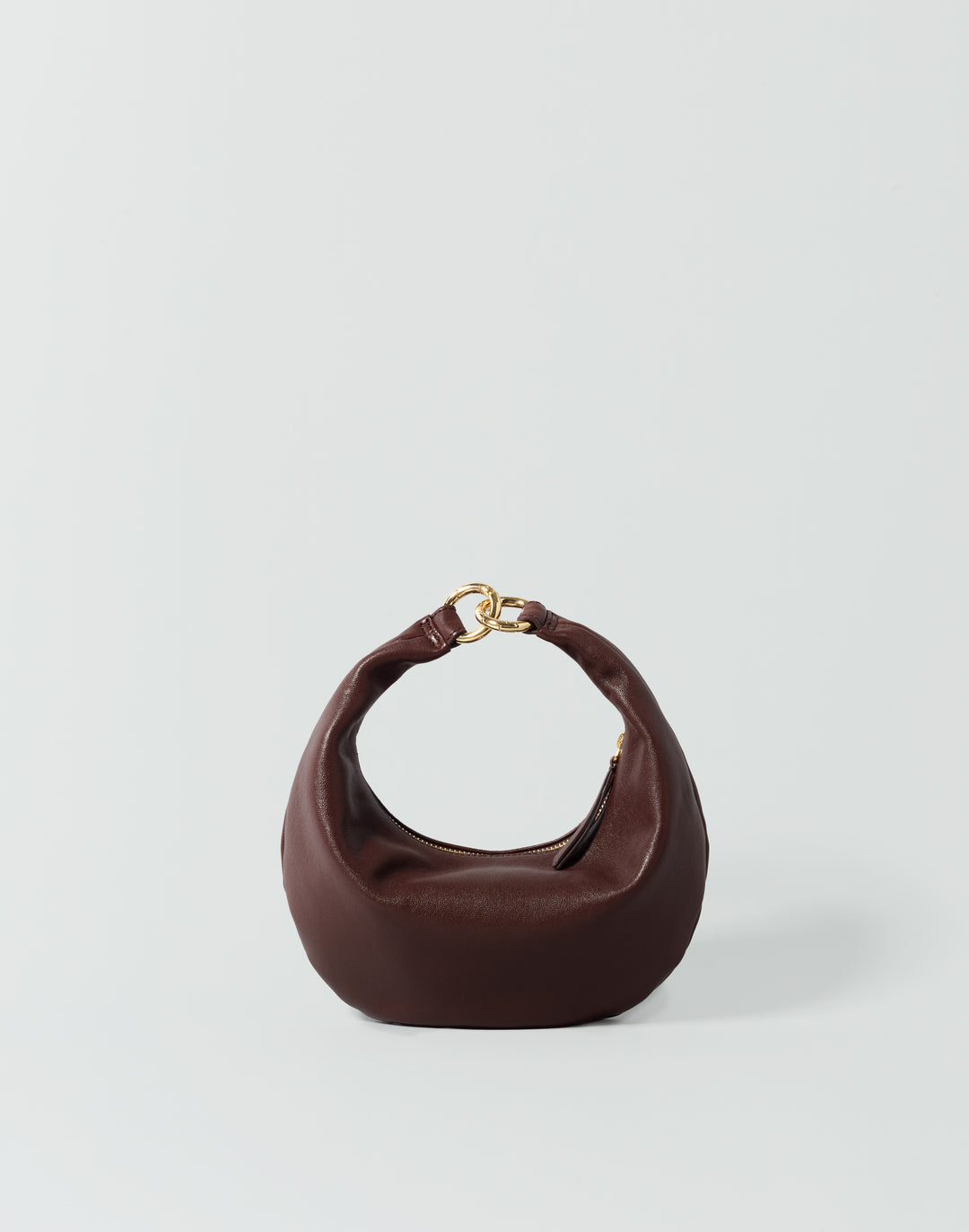 A reddish brown HYER GOODS micro ring bag crescent-shaped mini shoulder bag with a gold-tone metal clasp, set against a plain light gray background. #color_bordeaux-vintage