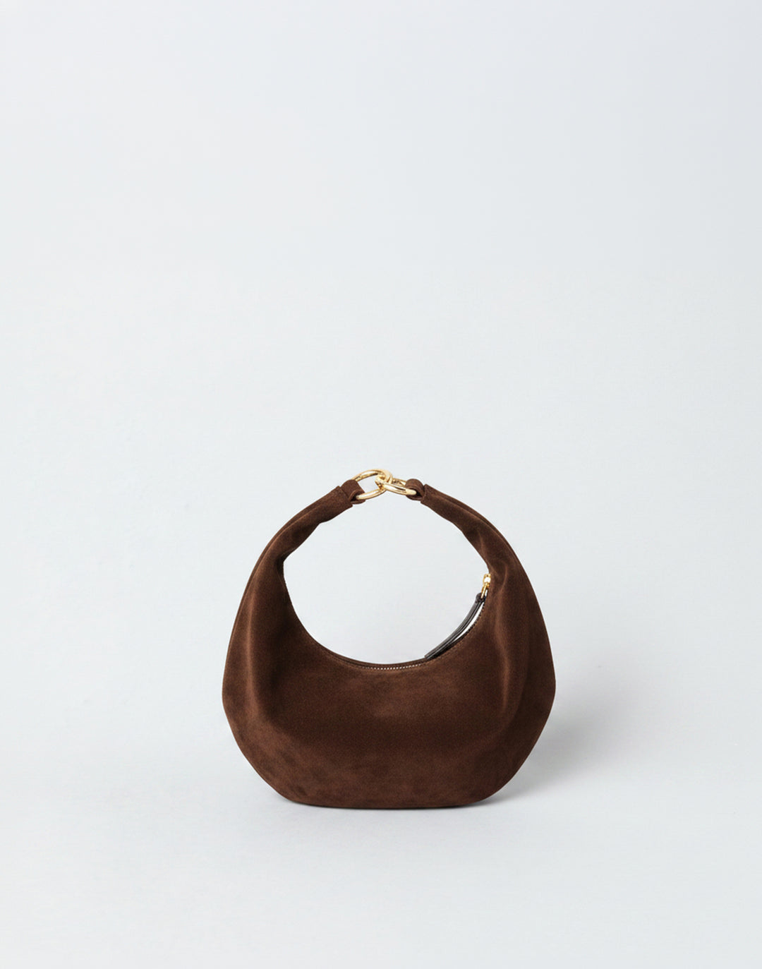 A dark brown suede HYER GOODS micro ring bag crescent-shaped mini shoulder bag with a gold-tone metal clasp, set against a plain light gray background. #color_chocolate-suede