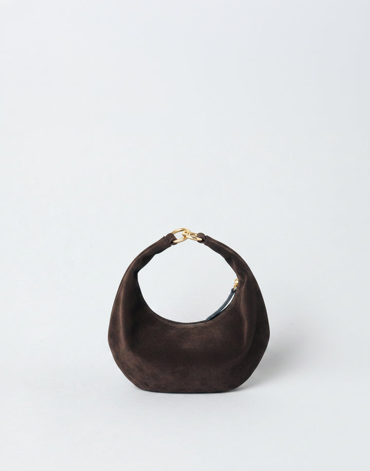 A dark brown suede HYER GOODS micro ring bag crescent-shaped mini shoulder bag with a gold-tone metal clasp, set against a plain light gray background. #color_chocolate-suede