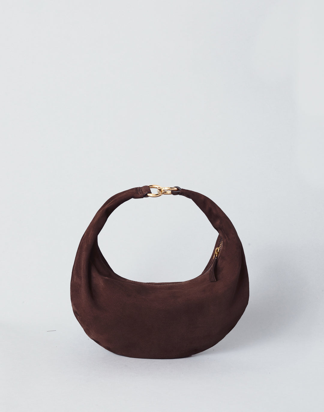 a crescent bag in a dark chocolate suede with gold hardware  #color_chocolate-suede