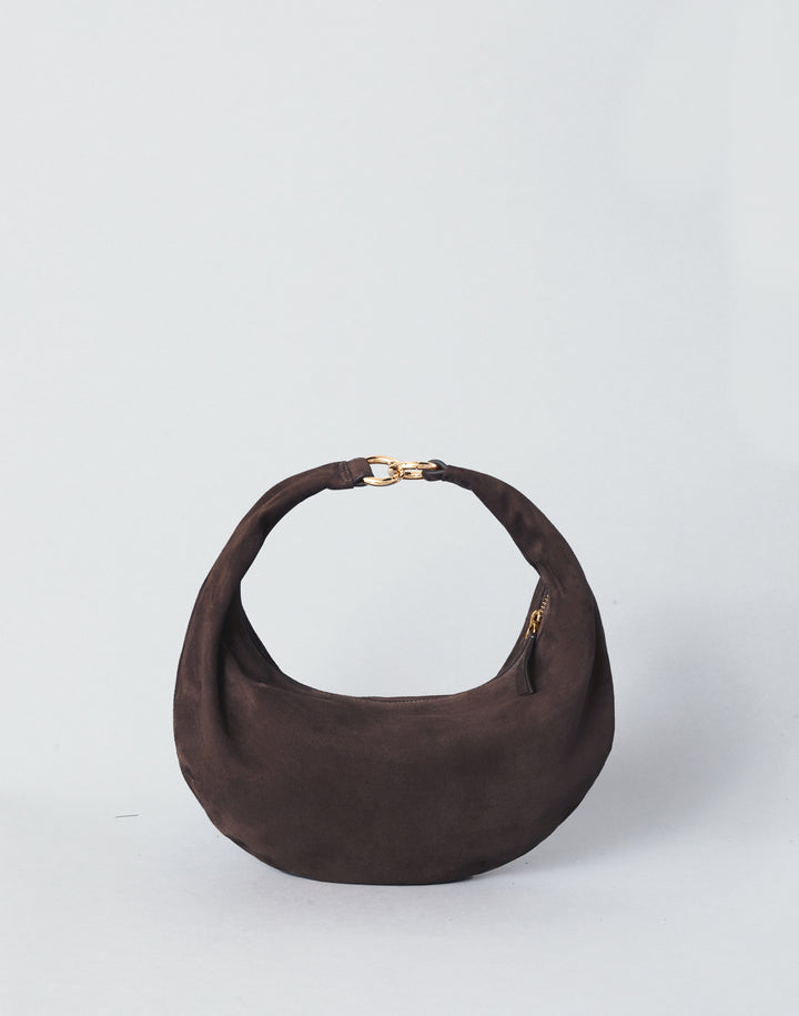 A HYER GOODS Piccola Ring Bag dark brown suede crescent-shaped shoulder bag with a gold-tone chain detail at the top of the strap, set against a plain light gray background. #color_chocolate-suede