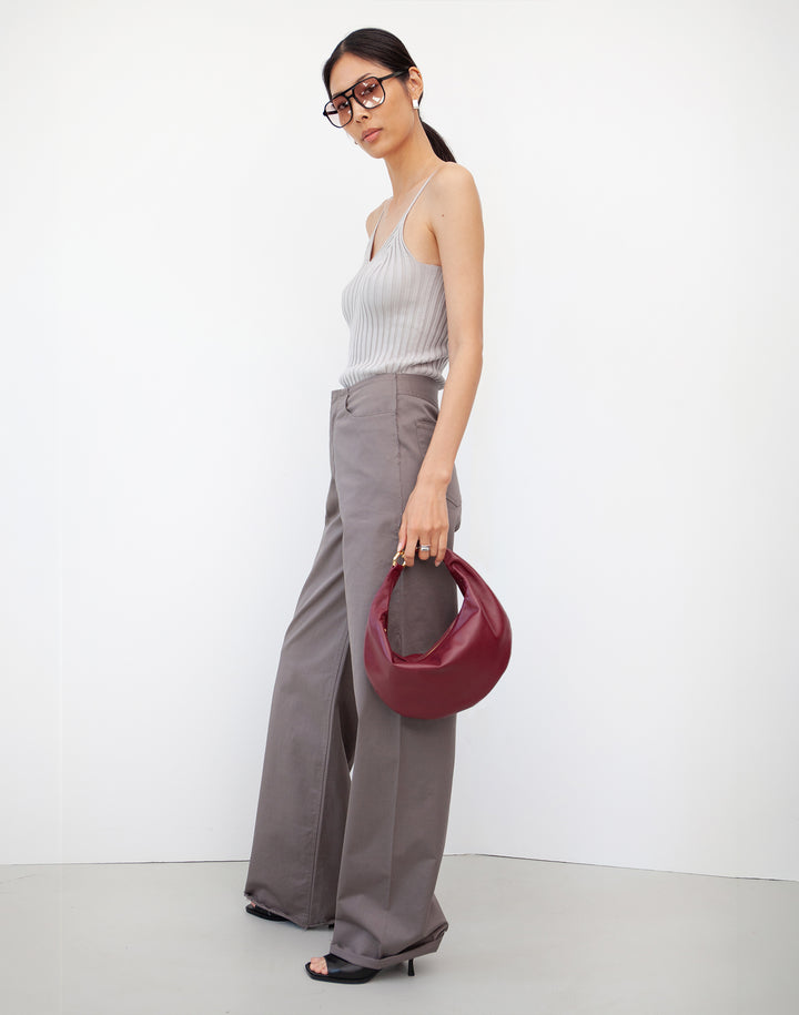 HYER GOODS convertible crossbody hobo Piccola ring bag worn as a handheld bag #color_dark-cherry-red