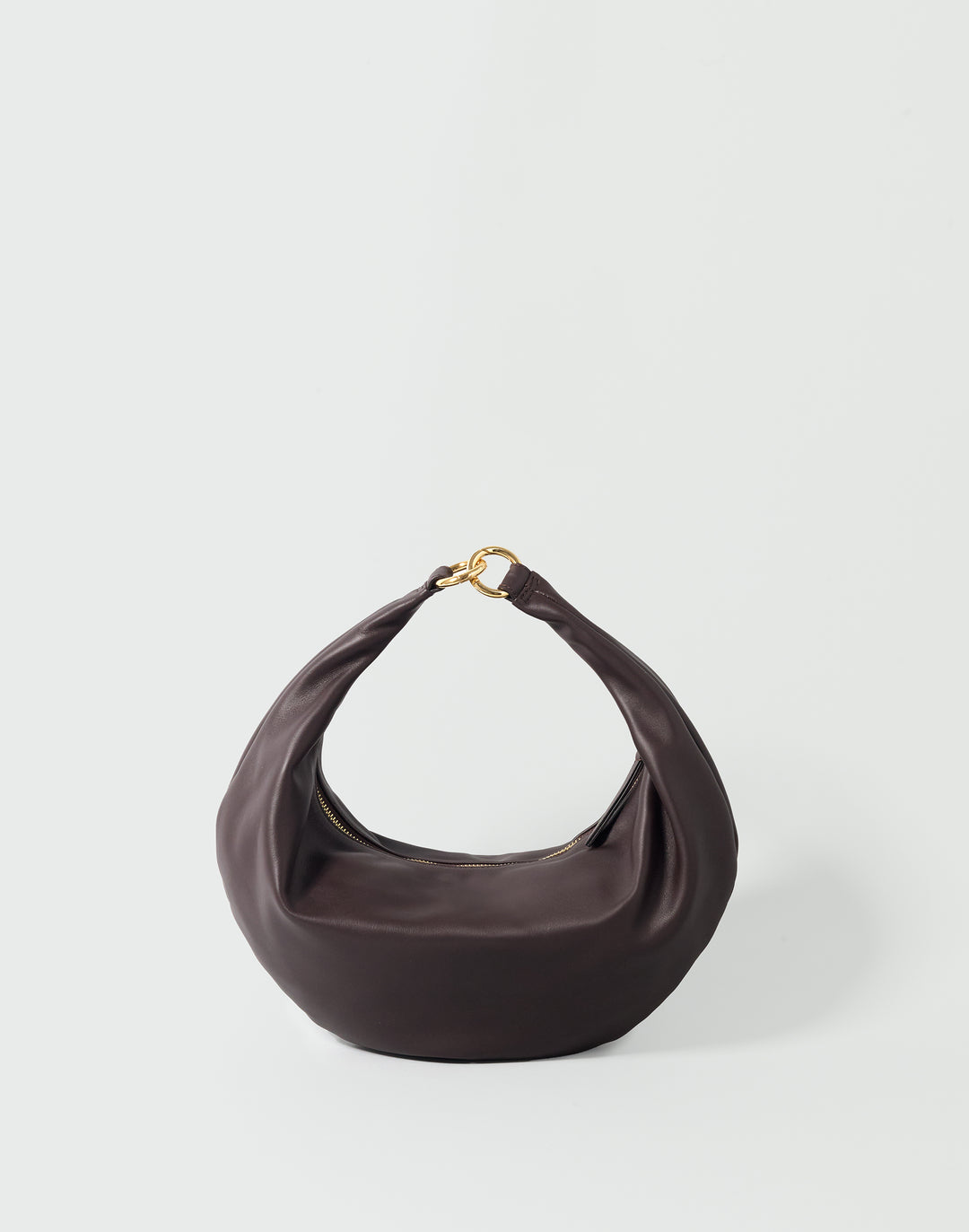 a dark brown leather crescent-shaped bag with gold ring clasp #color_chocolate