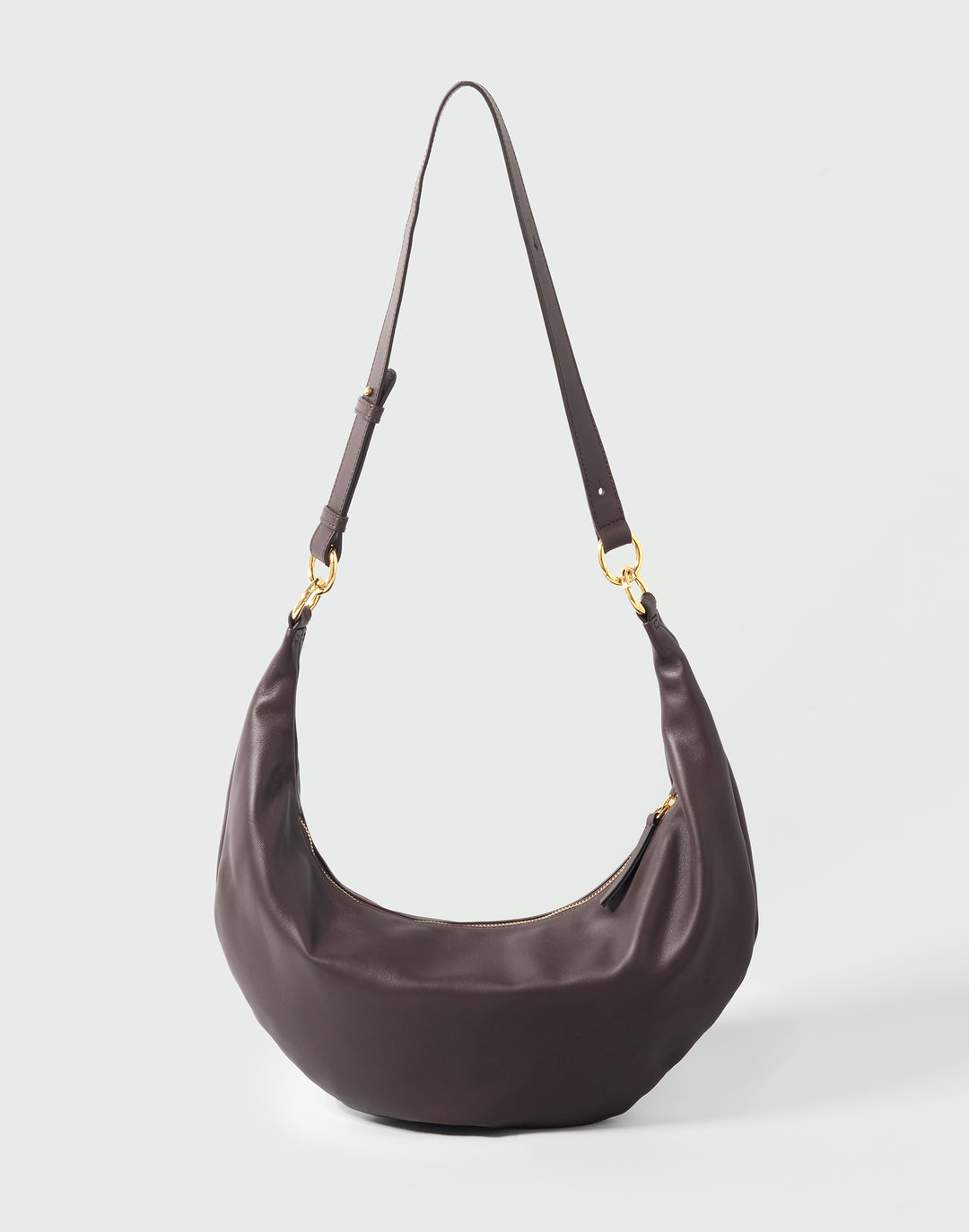 a dark brown crescent-shaped leather crossbody bag #color_chocolate