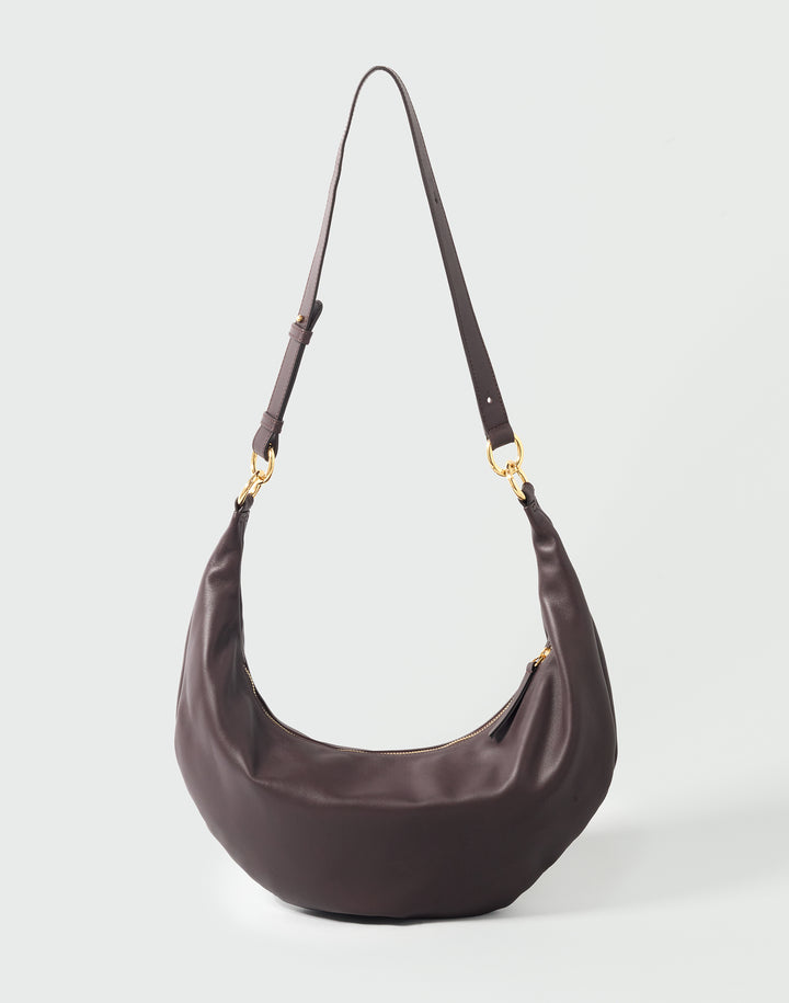 a dark brown crescent-shaped leather crossbody bag #color_chocolate