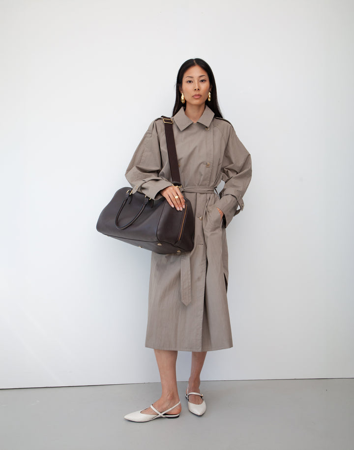 HYER GOODS dark brown leather la via weekender duffel bag worn as shoulder bag #color_dark-chocolate