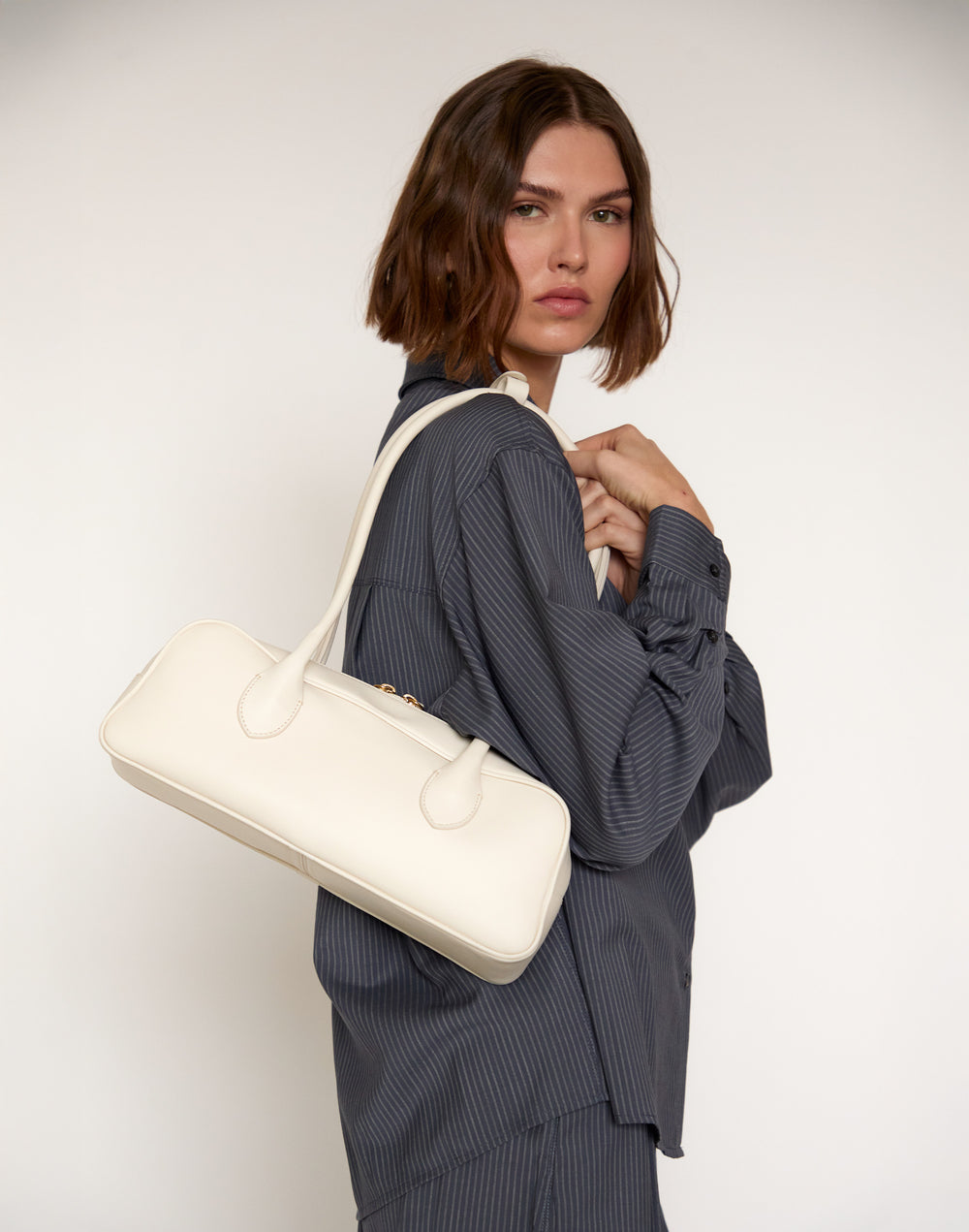HYER GOODS La Strada East West Bag in off-white #color_off-white