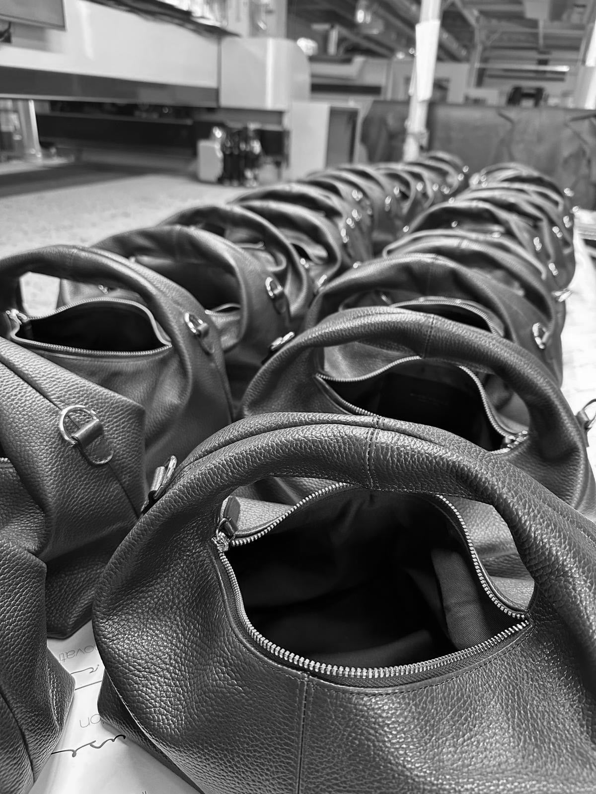 Italian tumbled leather handbags in the final stages of production.