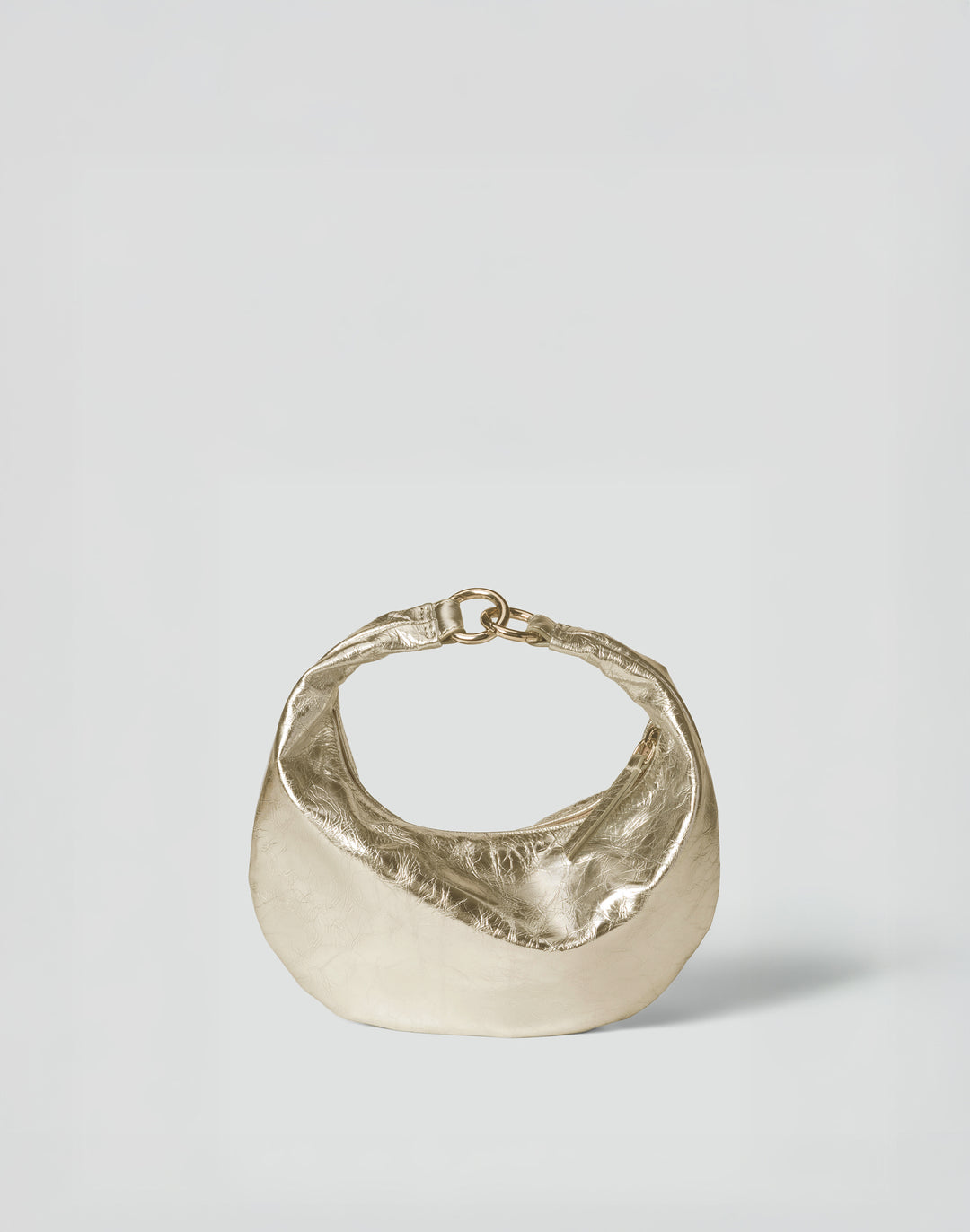 A textured gold metallic crescent-shaped handbag with a twisted strap and ring clasp, photographed on a clean light gray background. #color_gold